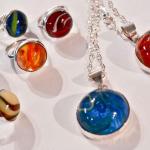 These are rings and pendents made from marbles that I cut in half and set in sterling silver.