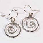 These dime sized spiral earrings are made out of sterling silver.