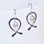 This is a pair of sterling silver and fresh water pearl earrings.  These earrings are $20 before tax and shipping.