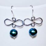 This is a pair of sterling silver and fresh water black pearl earrings.  These earrings are $20 before tax and shipping.