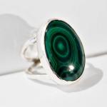 This is a sterling silver ring set with a large oval Malachite stone.  This ring is $60 before tax and shipping.